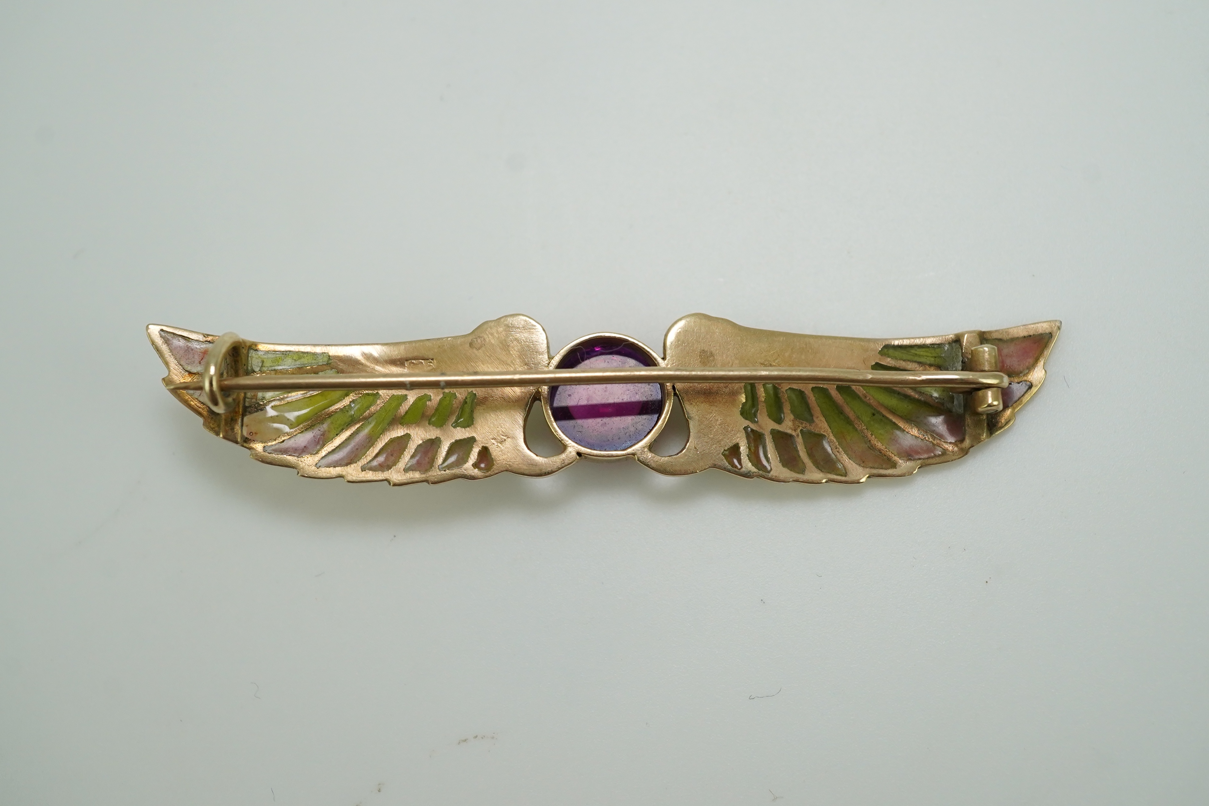 An Egyptian Revival tourmaline and enamel brooch, circa 1900